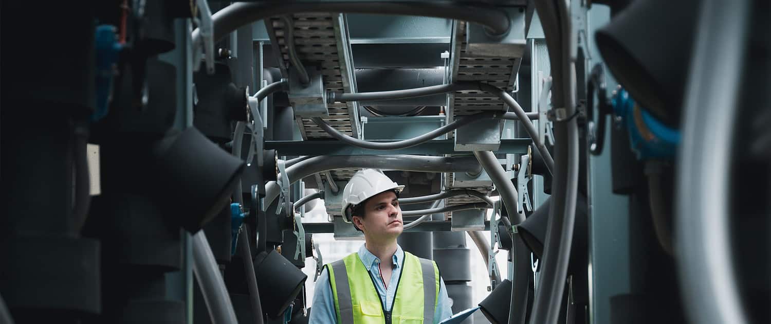 worker inspecting hvac unit